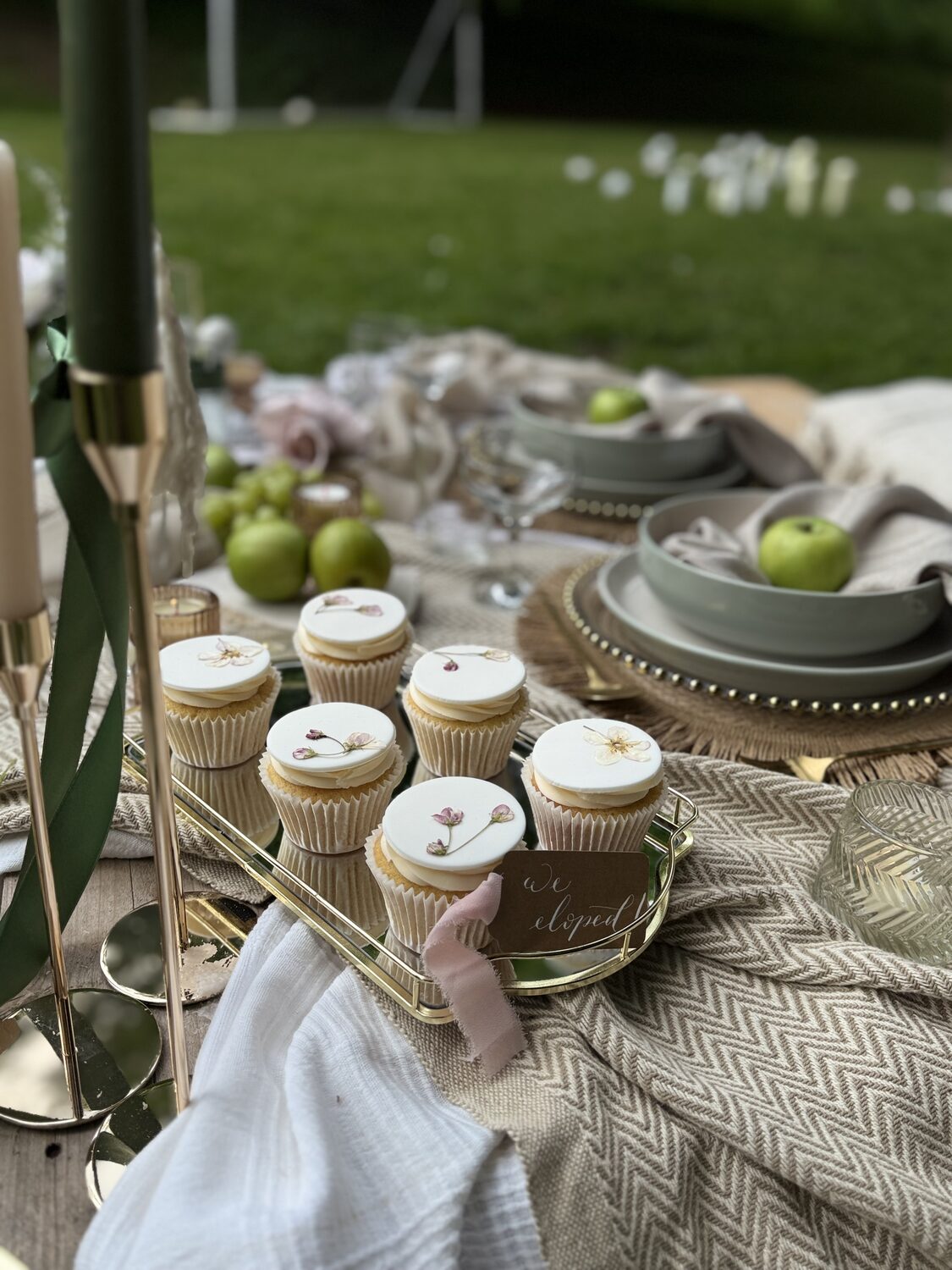 Close-up of wedding cupcakes and table details
